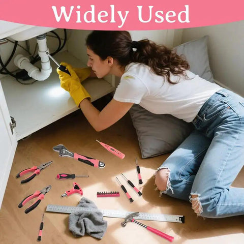 Woman using Pink 103 Piece DIY Tool Kit In A Compact Storage Case Built For Women And Beginners for home repairs under sink.