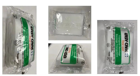 Trauma Pak First Aid Kit With QuikClot Sponge for Quick Bleed Control, showing packaged medical supplies including gauze and trauma pad.