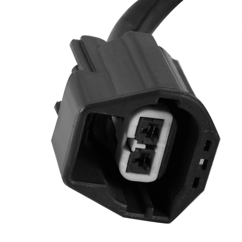 Close-up of AULINK two-pin automotive electrical connector, black plastic housing with white inner insert.