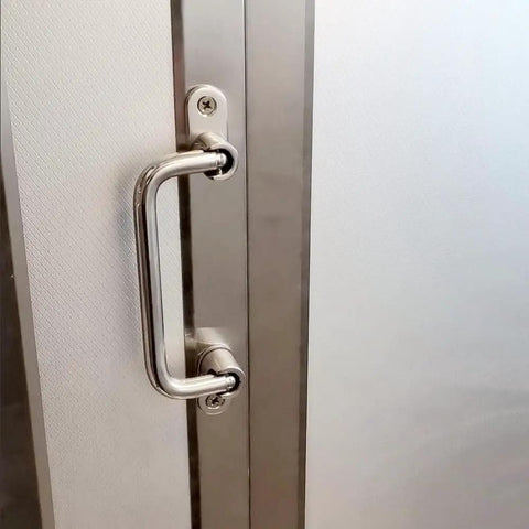 304 Stainless Steel Folding Pull Handle 90 Degree Door And Cabinet Pull Handle installed on door, 7 inch total length.