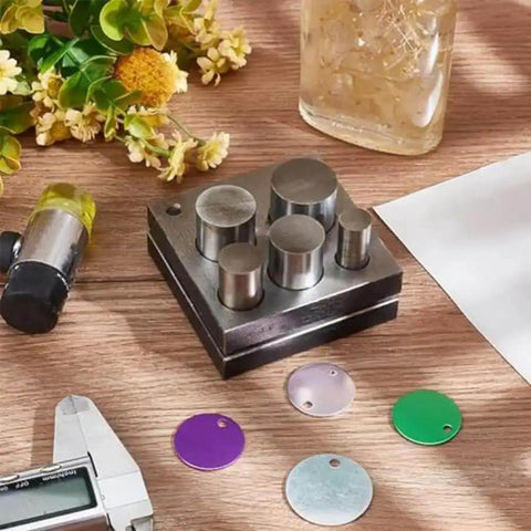 5 Piece Disc Cutter Set For Metal Jewelry Making With Round Punch Sizes 1/2, 5/8, 3/4, 7/8, And 1 Inch displayed on a table