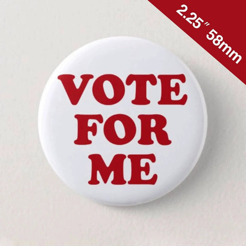 Front view of a 2.25-inch round button badge with white background and red VOTE FOR ME text.