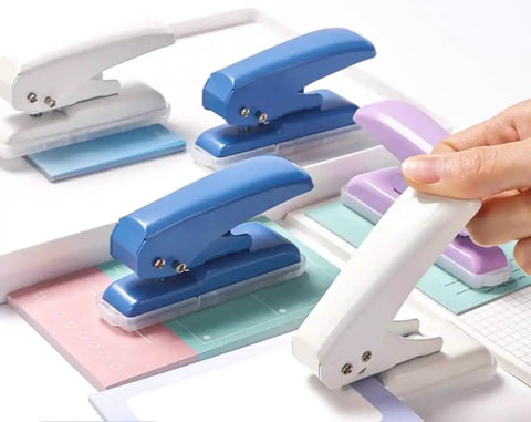 Assorted single hole punches including purple, showing different colors; Rugged Heavy Duty Single Hole Punch For Papers And Crafts 40 Sheets Capacity