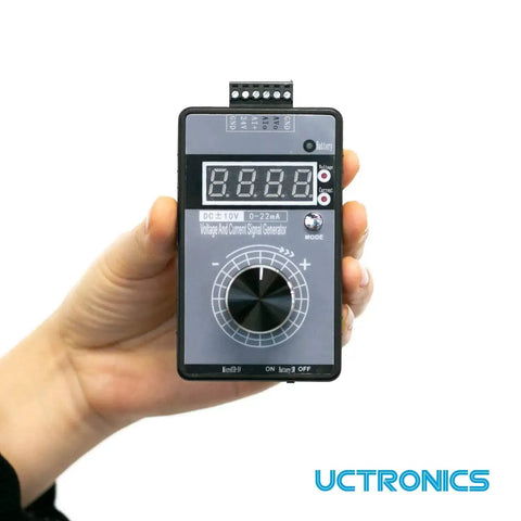 Hand holding a DC Plus Or Minus Ten Volt Output And Four To Twenty Milliamp Current Loop Signal Generator With USB Power.