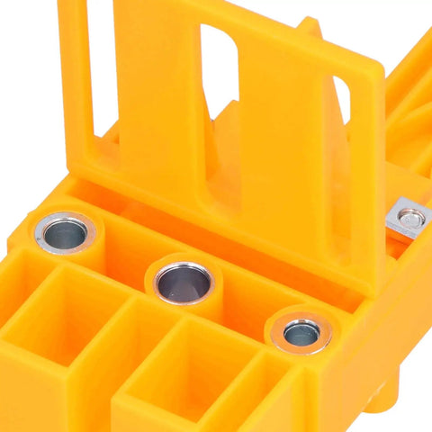 Close-up of Pro Grade Dowel Jig For Woodworking With 6mm 8mm 10mm Drill Bit Guide And 0-50mm Scale, showing chrome guide holes.