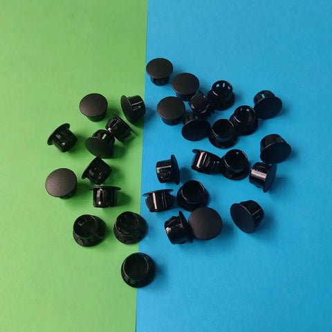 Thirty Pcs Black Plastic Hole Plugs For Cabinet And Screw Holes, 13 Mm Bottom Diameter, spread on colorful surface