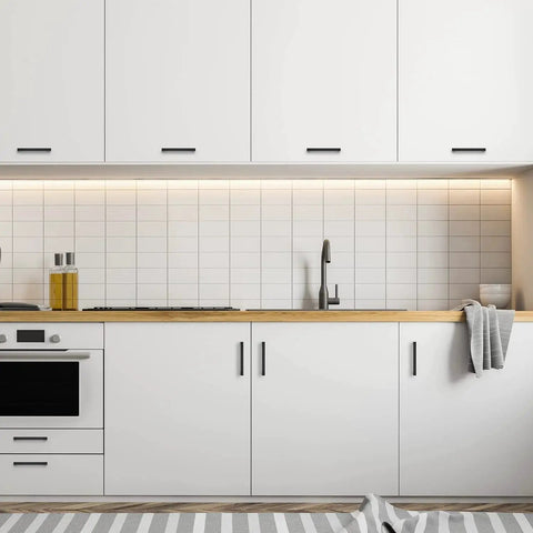 Modern kitchen with Matte Black Square Cabinet Pulls 5 Inch 30 Pack Handles installed on white cabinets and drawers.