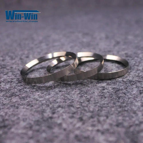 Three metal rings, Waterjet Pump Intensifier Back Ring Dynamic CP022012/780 For BFT BHDT Waterjet Cutting Machines, on grey surface