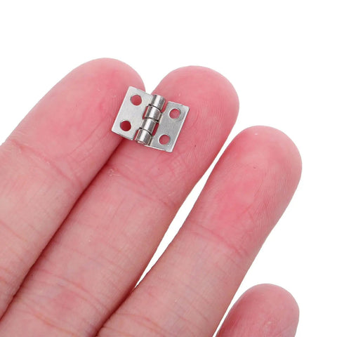 Mini Metal Hinge Set For Dollhouse Furniture And Jewelry Boxes, 10x8mm With Screws, Silver Tone, shown on fingertip