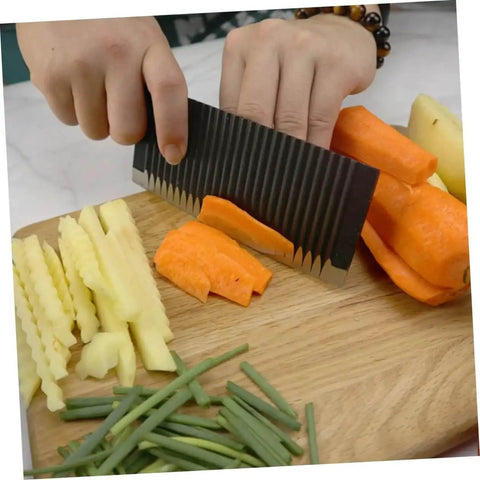Hand using Wavy Cutter For Vegetables And Fruits Stainless Steel Crinkle Slicer Cuts Potatoes Carrots Onions Cheese And More