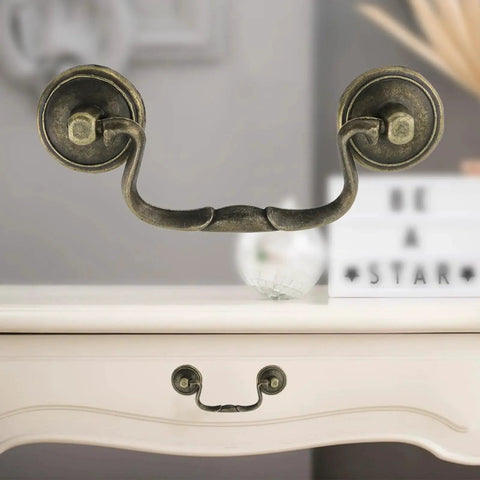 Set Of 6 Antique Bail Handle Drop Pulls With Screws In Vintage Bronze on white cabinet, 3.3 inch hole centers, 4.4 inch total length