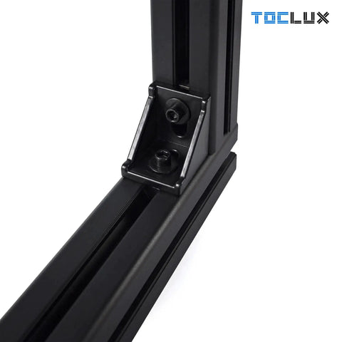 Close-up of black 4040 aluminum extrusion with corner bracket and screws, part of 10 Sets Black 4040 Aluminum Extrusion Corner Bracket Kit With 10 Corner Brackets 20 M6 Spring T Nuts And Hex Screws Plus 1 Ball End Hex Wrench For 40 T Slot Extruded Aluminum Accessories Must Have For Builders.