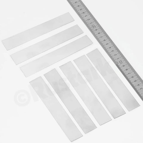Stainless Steel Shim Stock Kit 30 Piece Set, 10 Sizes, 1 Inch Width By 6.1 Inch Length, Thickness From 0.0007 To 0.01 Inch showing various shims and a ruler for size reference.