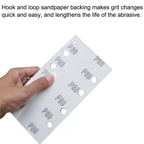 Person holding P80 hook and loop sandpaper sheet with holes for 1/3 sheet sander, part of the versatile grit set for woodworking and metalworking projects.