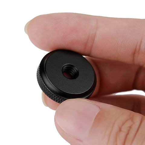 Close-up of a 1/4-inch female thumb nut with rubber pads, anti-slip washer, designed for secure camera attachment, rust-resistant aluminum.