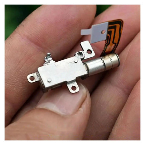 Close-up of compact High Precision 5mm Gearbox Stepper Motor With 8mm Stroke Linear Actuator for cameras and phones in hand.