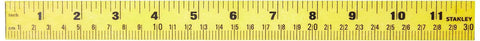 Close-up of a 12-inch professional level with a shock-resistant, non-marring ABS body and top-read vial, high visibility yellow.