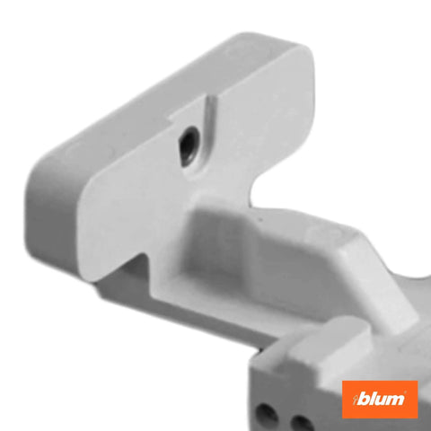 Close-up of precision drilling template for concealed undermount drawer runners with hole alignment feature.