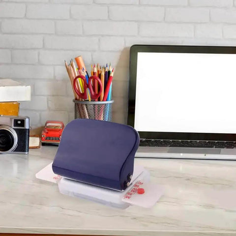 6 Hole Puncher For A4 A5 B5 Notebooks And Scrapbooks Handheld Metal Circle Paper Puncher on a desk with office supplies