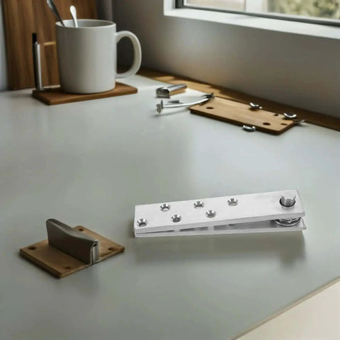 360 Degree Stainless Steel Hidden Door Pivot Hinges on table for secret doors and cabinets, built to last, concealed hardware