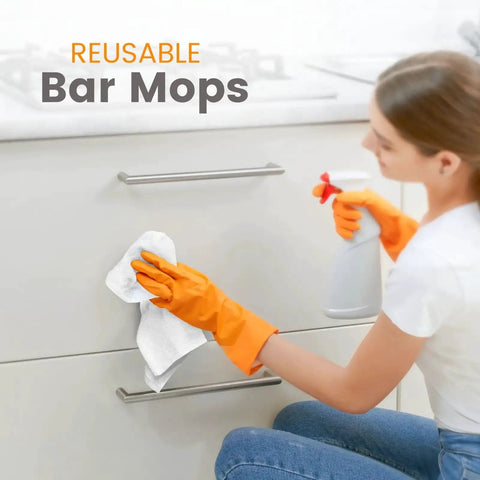 Person cleaning kitchen cabinet with Absorbent Quick Dry Bar Mop Towels Pack Of 60, 14x17 Commercial Grade Cotton Cleaning Rags For Kitchen And Bar, White