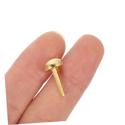 Close-up of a brass mini nail from 100Pcs Brass Mini Nails And Tacks For Scrapbooking, Card Making, And DIY Paper Craft Embellishments