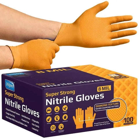 Person wearing 8 Mil Orange Nitrile Gloves Heavy Duty Diamond Textured Industrial Food Handling with box, showcasing texture.