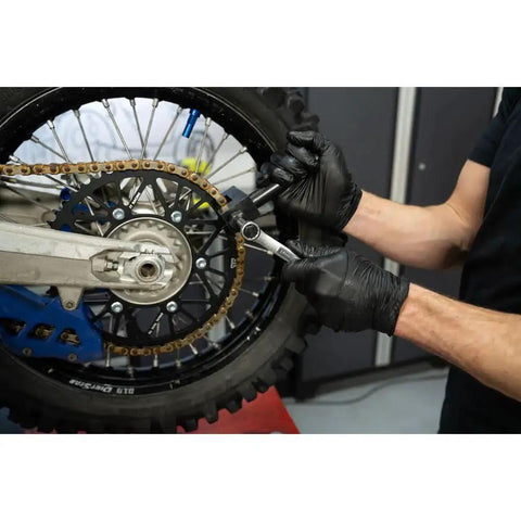Person using Heavy Duty Chain Breaker Rivet Tool For 520 525 530 Chains And Master Links Tusk Edition on motorcycle chain