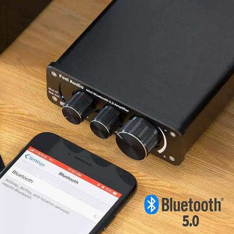 BT10A Bluetooth 5.0 Stereo Amplifier Receiver 2 Channel Class D Mini Hi Fi Integrated Amp for home passive speakers 50W x 2 shown with phone