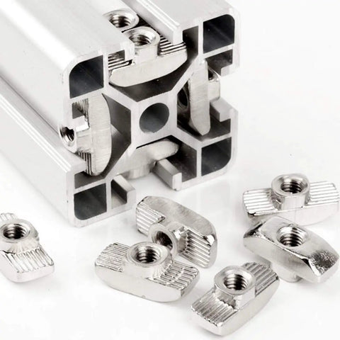 50 Pack 4040 Series M6 T Slot Nuts Hammer Head Fasteners For Aluminum Profiles Nickel Plated Carbon Steel Nut Rust Resistant Easy Install Heavy Duty T Nuts For 4040 Extrusion shown next to an aluminum profile.