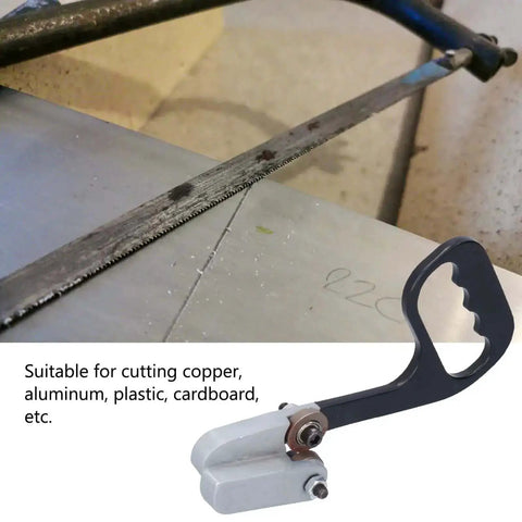 Kickass Metal Sheet Cutter With Dual Circular Edge Blades shown on a metal and cardboard surface, handheld and portable tool.