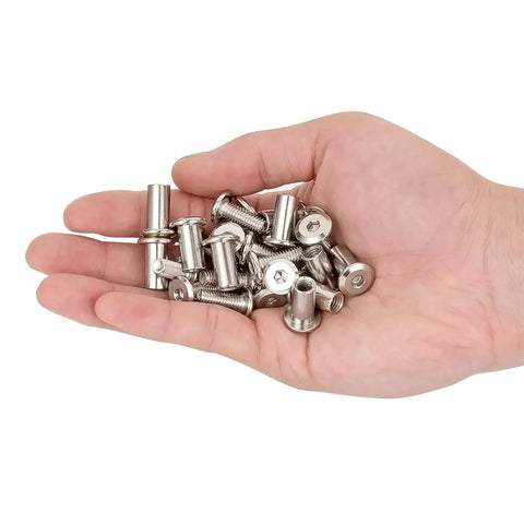 Hand holding 100 Piece Silver Hex Drive Set Screw Kit With M6x15mm Socket Cap Bolts And Nuts For TV Mounts Binding Posts And Rivet Connectors