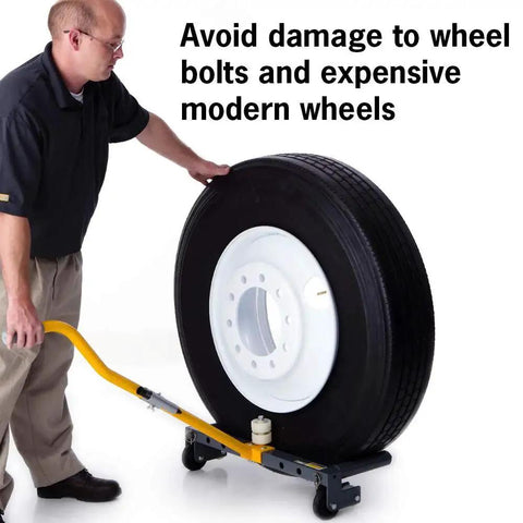 Rolling wheel dolly side view with yellow push bar supporting a large tire on a black frame