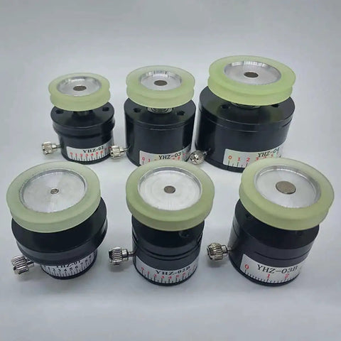 Six black YHZ magnetic dampers with white dial scales and pale yellow tops