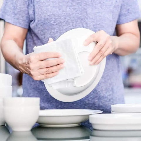 Person using Lint Free 100 Percent Cotton Cleaning Rags 15 Pack 18x18 White Cloths for dishes and cleaning surfaces.