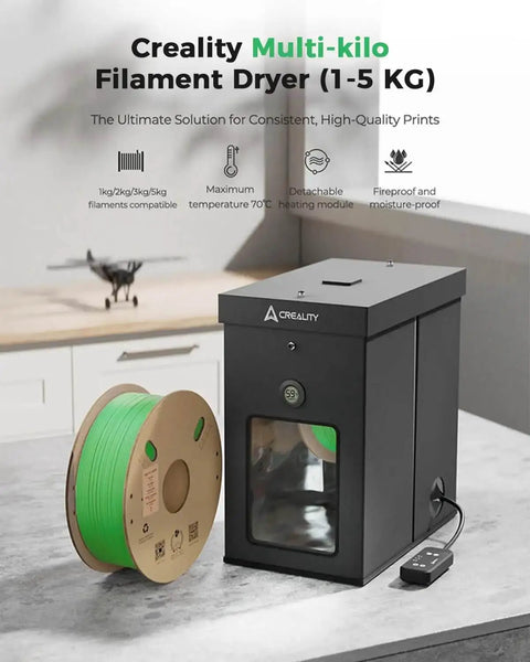 Large Kilo Filament Drying Storage Box With Detachable Heating Module For 1Kg To 5Kg Spools beside green spool on table