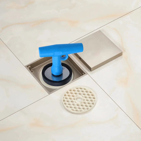 Rugged Stainless Steel Deck Drain Plug Fits One And Three Quarters To Two And A Quarter Inch Openings With Universal Rubber Expansion Seal in tile