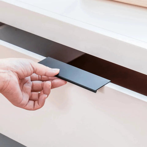 Hand installing 10 Pack Black 3 Inch Edge Finger Cabinet Pull on drawer, showing 76mm center to center in durable aluminum alloy hardware