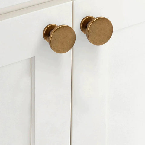 Set Of 10 Antique Brass Cabinet Knobs And Zinc Alloy Drawer Pulls For Kitchen Cabinets And Furniture installed on white doors.