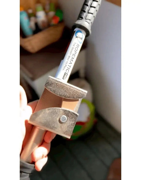 Close-up of Ropematic Pro Manual Rope Puller for Fish Tape and Mule Tape Pulling, ergonomic handle, metal components visible.