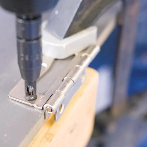 Clic-Change 1/4 In Self-Centering Drill Bit Set, 3-Piece by Bosch in use on a hinge, quick change for precision drilling