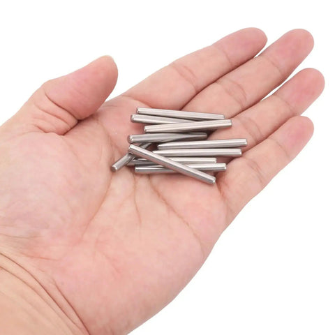 Hand holding 50 Pcs 4mm By 40mm Dowel Pins In 304 Stainless Steel Durable Shelf Support Pegs For Furniture And Woodworking Corrosion Resistant Fasteners Ideal Assortment For Quick Fixes And Projects