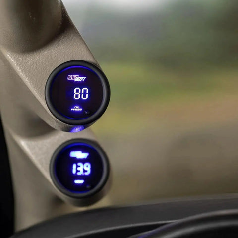 Digital 10 Color Oil Pressure Gauge Kit With 0 To 145 Psi Range installed in car dashboard, lit multi-color LED display.