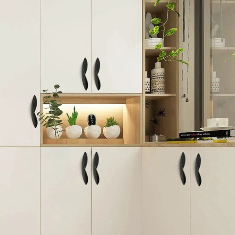 Arcuate Pulls S Shaped Cabinet Handles 5 Inch Center Matte Black Solid Zinc Alloy 4 Pack mounted on white cabinets
