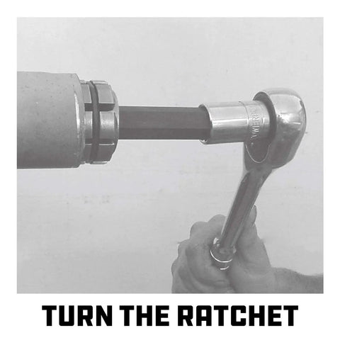 Using a Tailpipe Expander Fits One Eighth To One And Three Quarters Inches Exhaust Pipe with ratchet tool in garage.