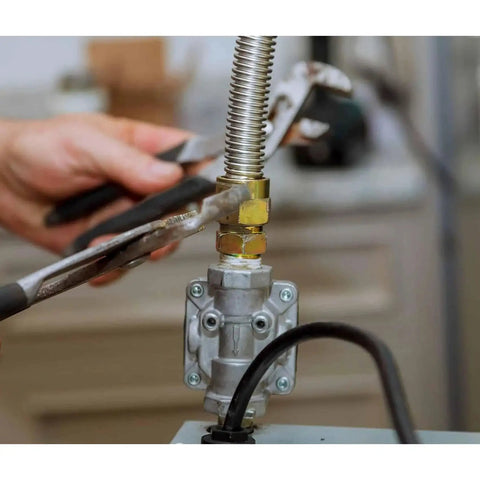 Gas Pressure Regulator For Liquefied Propane And Natural Gas With Five Inch Water Column Natural Gas Outlet And Ten Inch Water Column Propane Outlet, installation view with wrench.