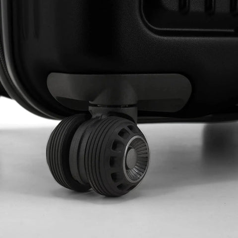 Close-up of 360° wheel on Ultimax II 26 Inch Spinner Luggage With Tie Down Straps Matte Black Built To Last Durable Polycarbonate Hardside Case