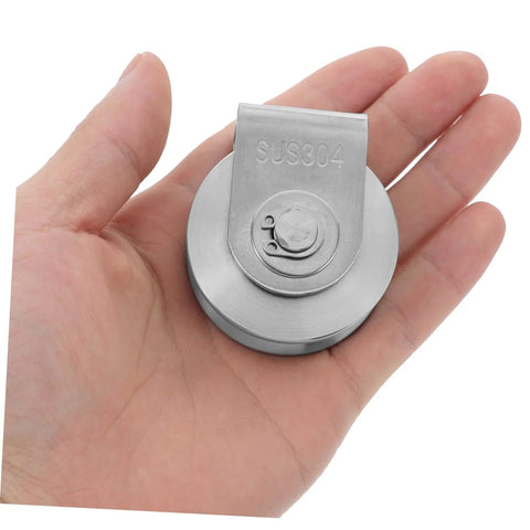 Hand holding heavy duty sliding gate guide roller and stainless steel pulley for track doors, pro grade industrial hardware.