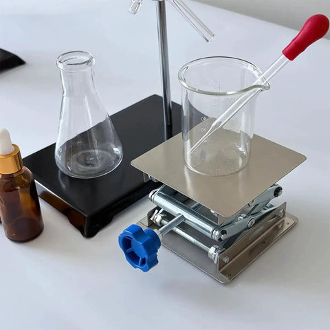 Stainless Steel Lab Jack Stand Scissor Lift Table 4x4 Inch Adjustable Height with beaker and pipette on workbench