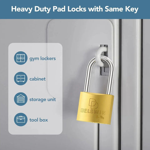 DELSWIN brass weatherproof padlock with key on gray door hasp; 1-9/16 in shackle (front view)